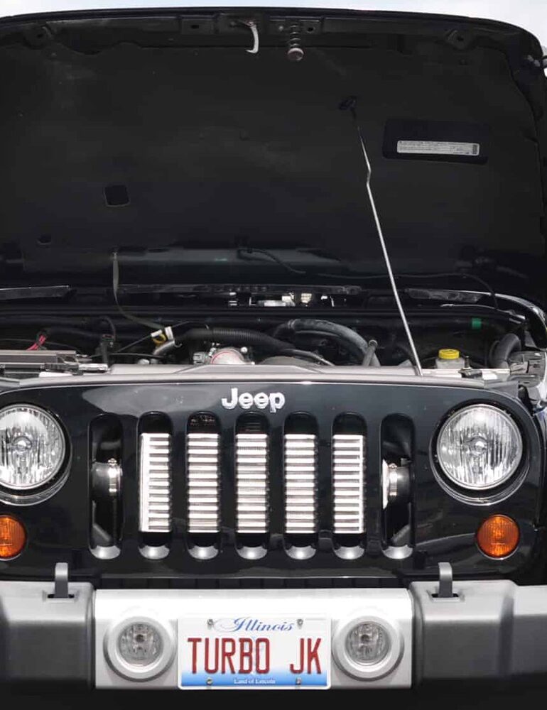 Black JK Jeep Wrangler with hood open