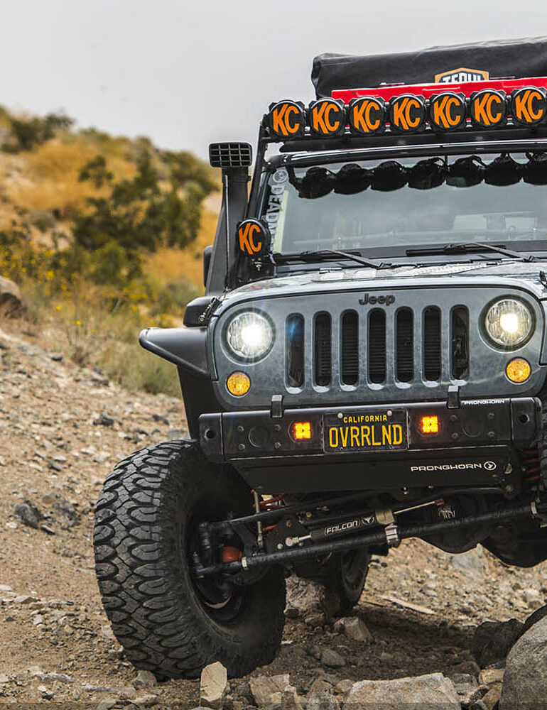 Grey Jeep offroading outdoors